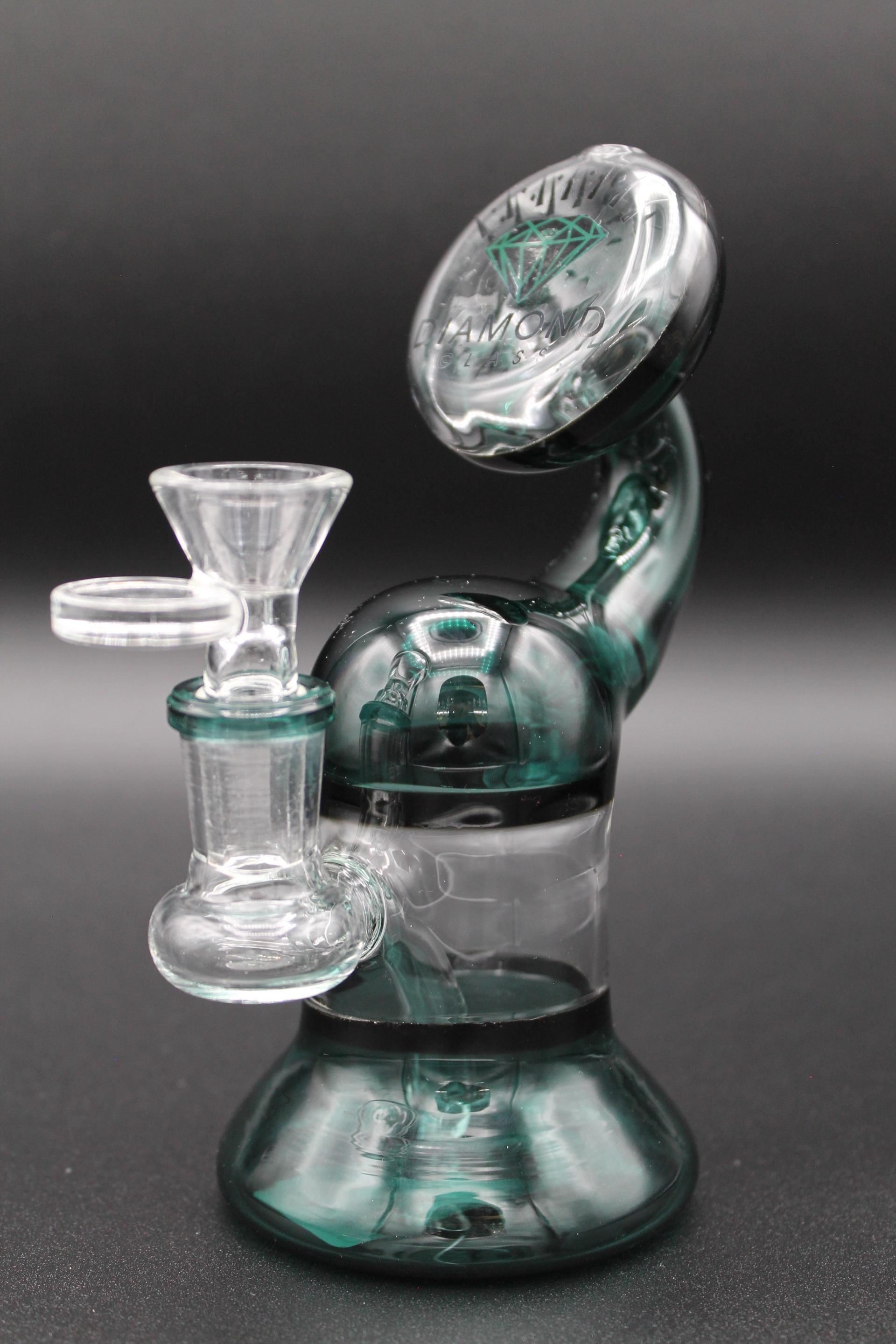 Glass smoking device with diamond logo and intricate clear and teal design