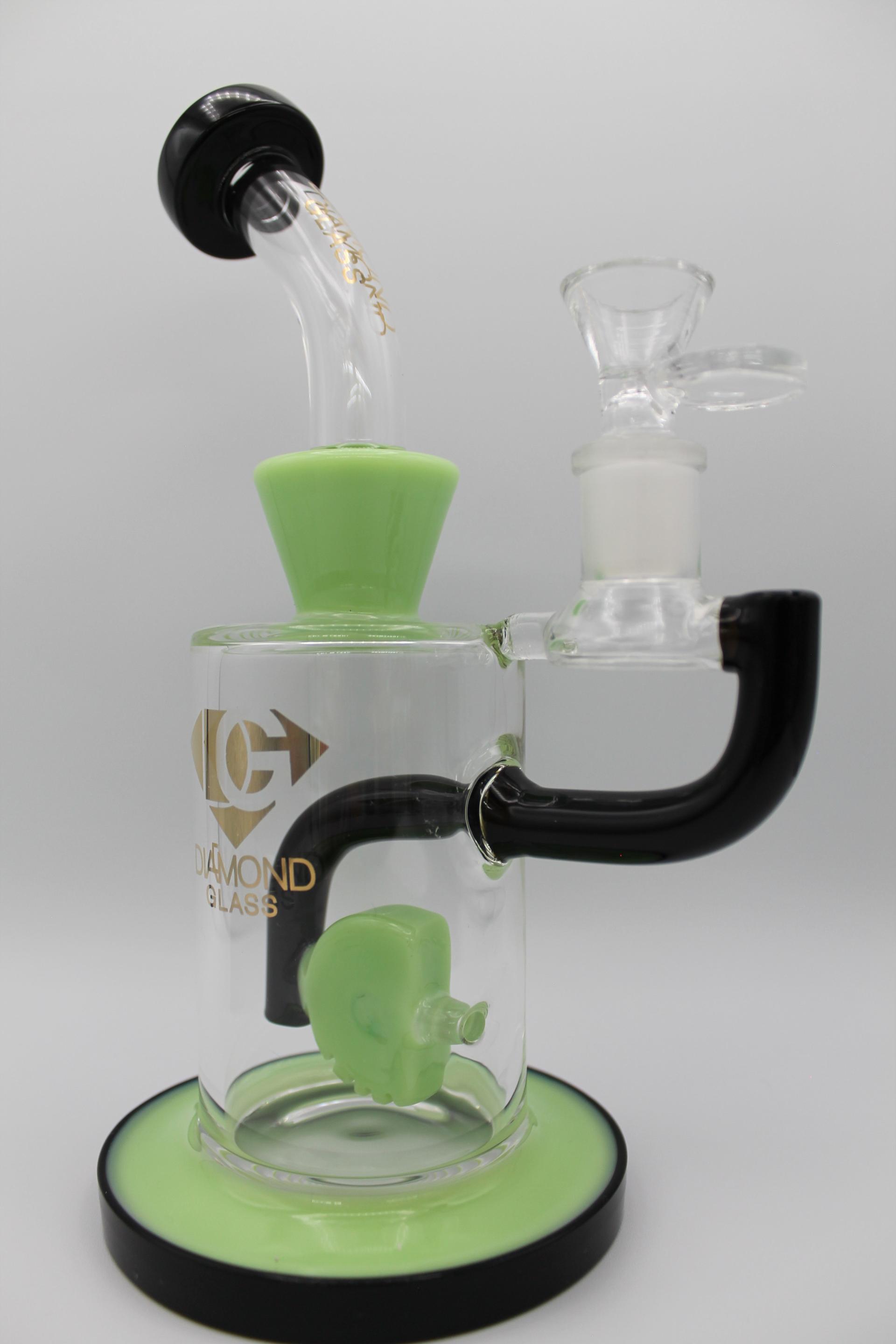 Green and black Diamond Glass dab rig with intricate glass design
